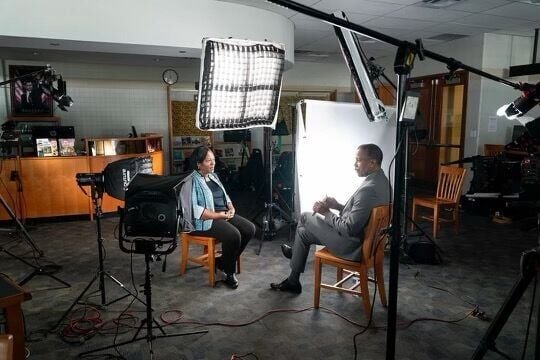 St. Mary's Principal Pamela Rogers interviewing with Bill Whittaker of CBS